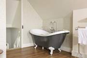 Relax in this luxurious free-standing bath.