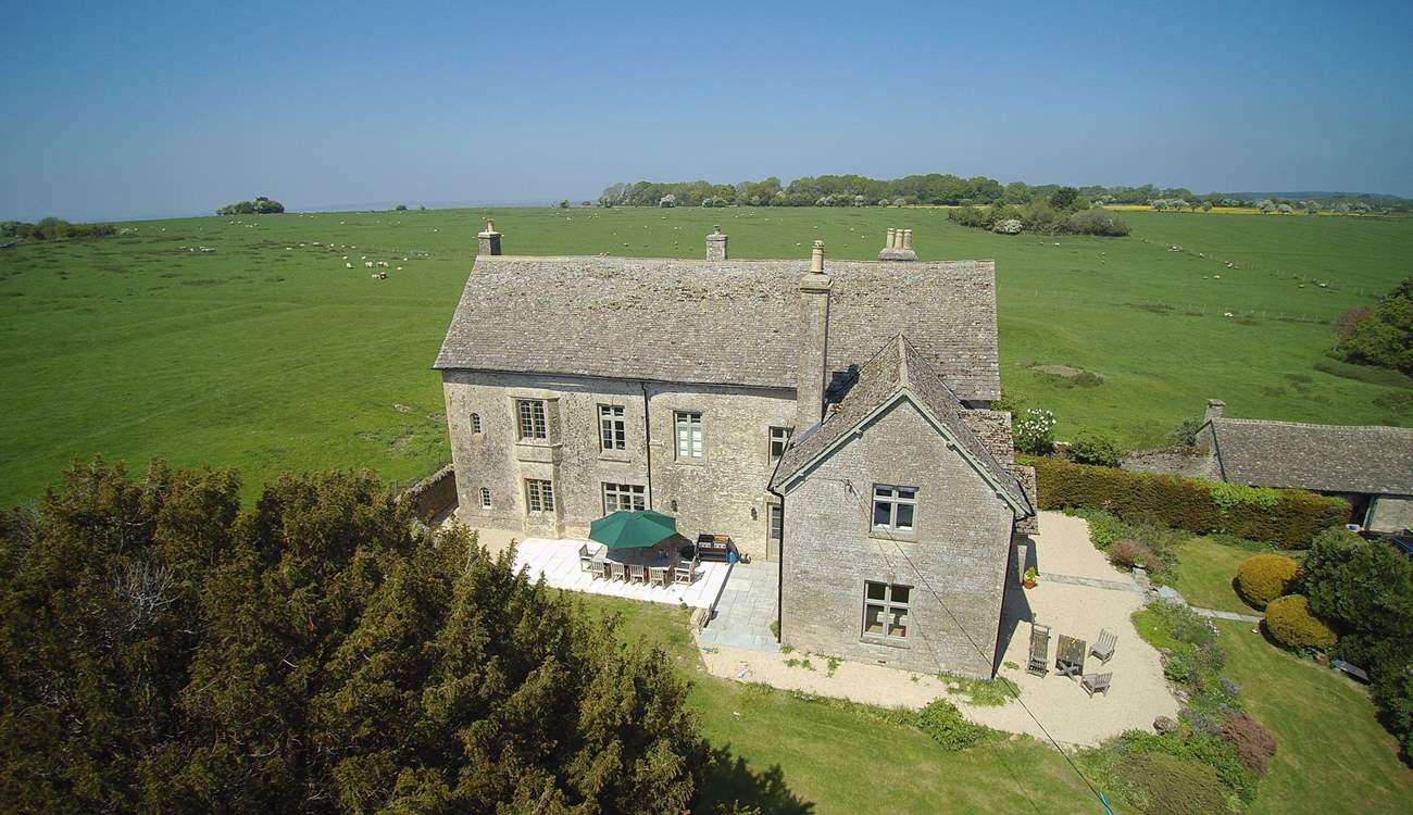 The western side of the property has the lovely outside dining-area, there is also additional seating towards the front.
