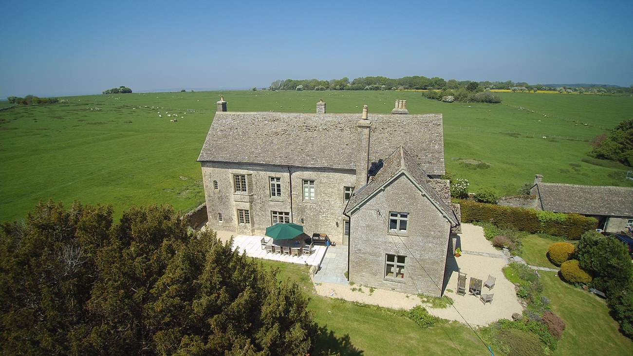 The western side of the property has the lovely outside dining-area, there is also additional seating towards the front.