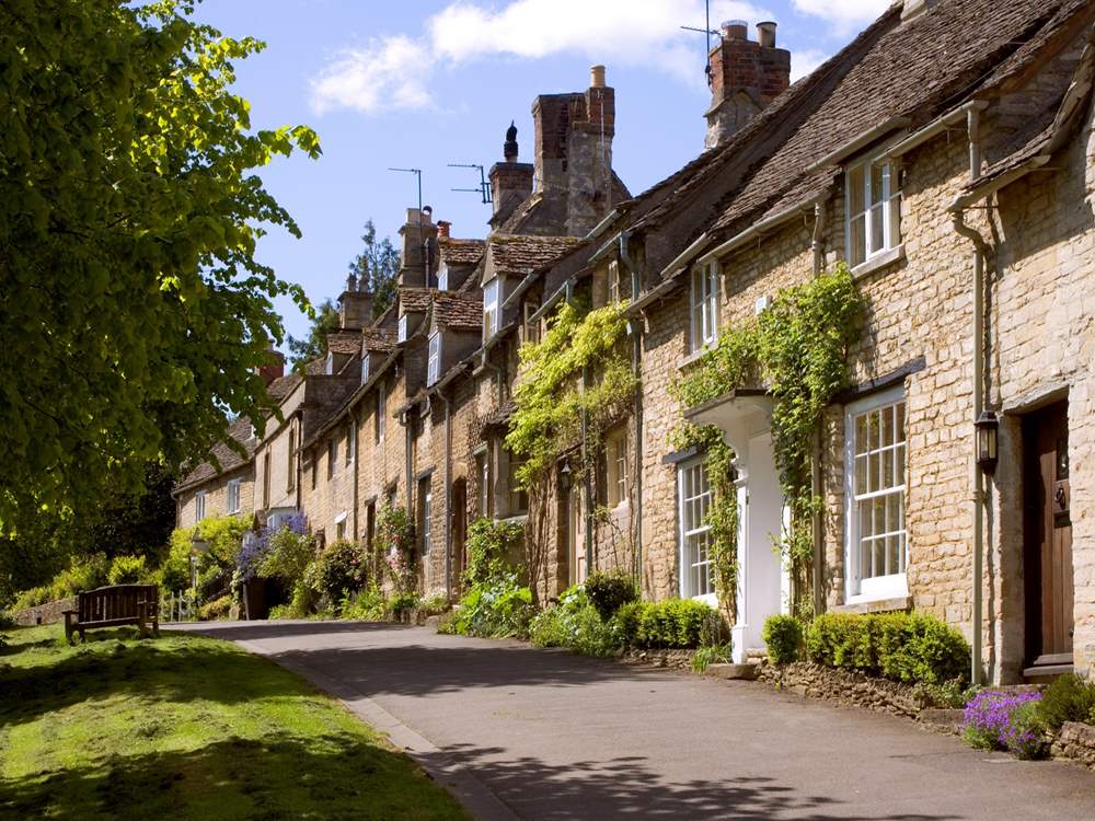 Burford is one of the most picturesque towns in the Cotswolds, with its medieval bridge, stone houses and ancient church.