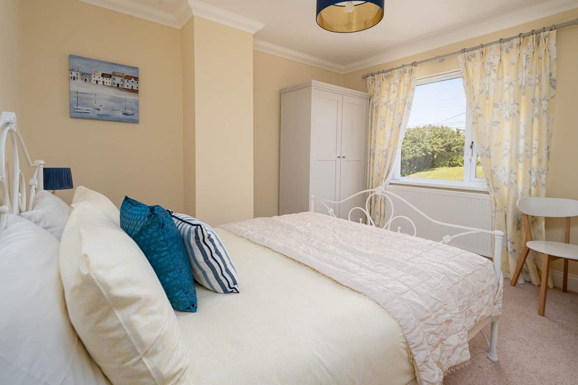 Sweet dreams in the rear facing room with garden views.