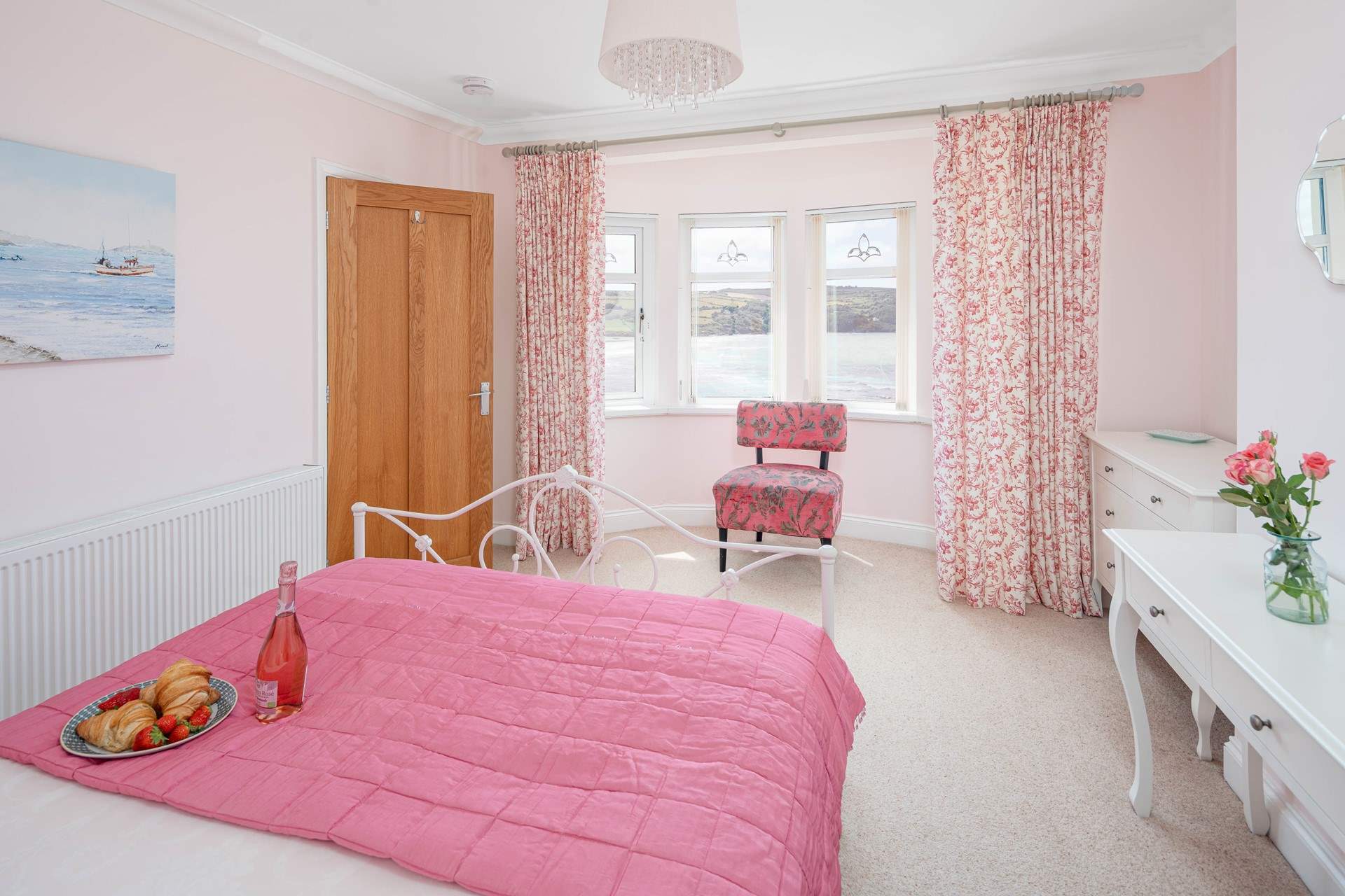 Pretty pink room with stunning sea views. 