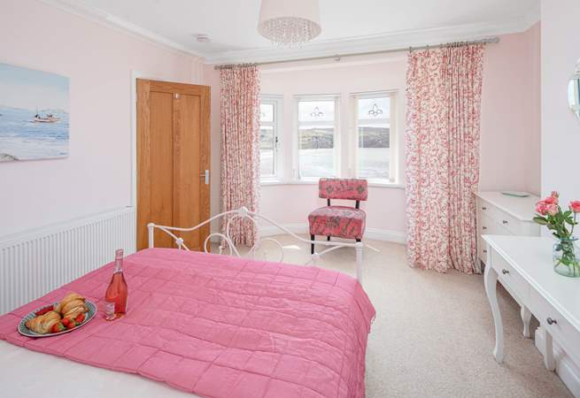 Pretty pink room with stunning sea views. 