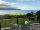 Take in the captivating sea views from the front terrace after relaxing in the hot tub.