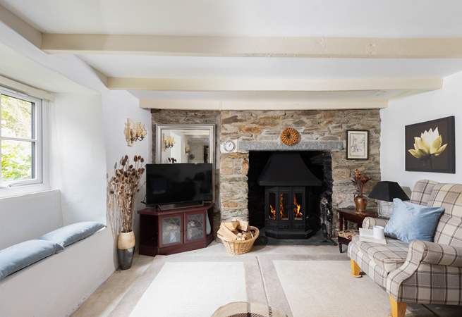 The pretty window seat, exposed beams and painted stonework add to the overall character of Rivendell Cottage.