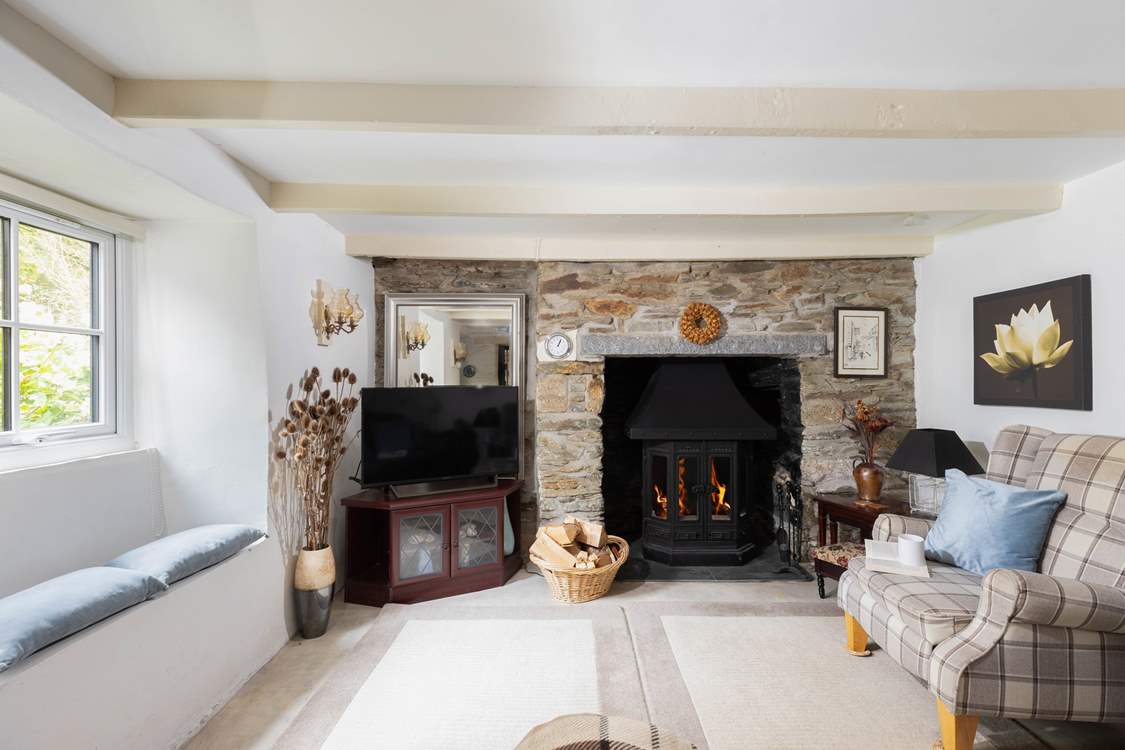 The pretty window seat, exposed beams and painted stonework add to the overall character of Rivendell Cottage.