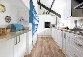 The galley style kitchen serves up the perfect blend of modern style and country charm.