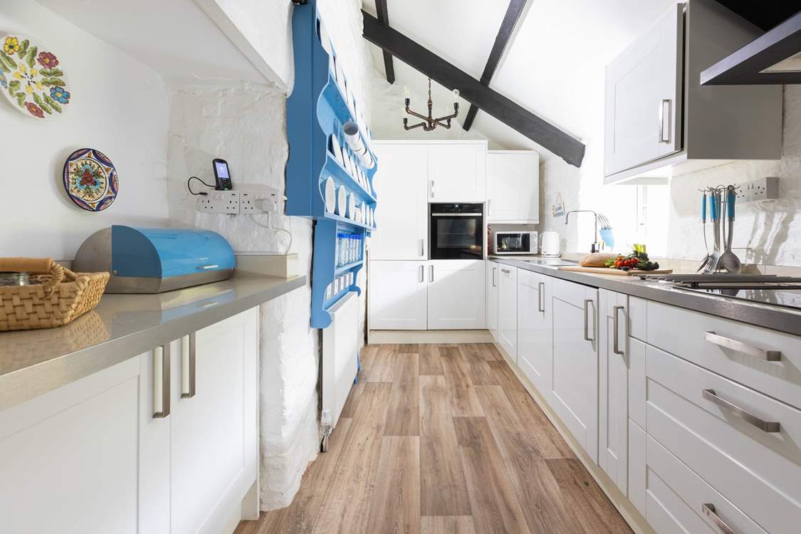 The galley style kitchen serves up the perfect blend of modern style and country charm.