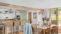 Plenty of space to dine. Pull up a chair at the breakfast-bar and enjoy a chilled glass of wine as lunch is prepared, or relax around the farmhouse table with a leisurely supper.