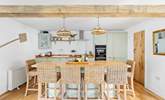 The stylish kitchen has a lovely island, the perfect spot for a catch up whilst the chef works their culinary magic. - Thumbnail Image