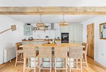 The stylish kitchen has a lovely island, the perfect spot for a catch up whilst the chef works their culinary magic.