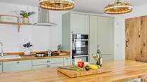 The kitchen is fully equipped and ready for you to prepare a family feast.