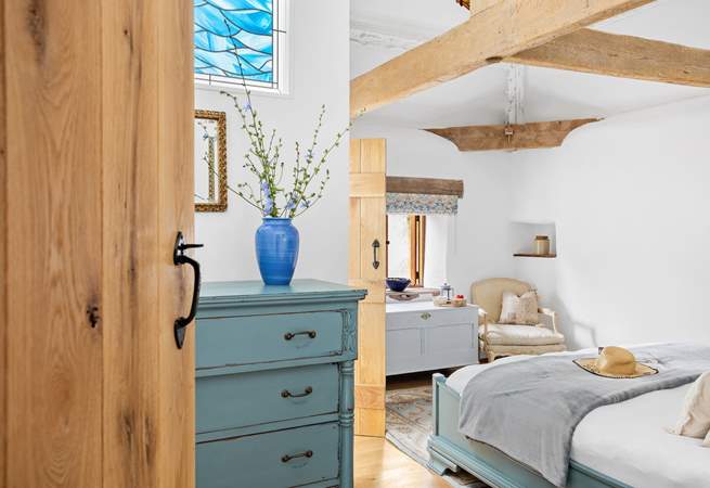 A gorgeous vaulted en suite bedroom awaits your arrival.