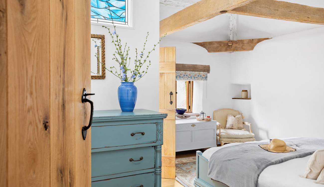 A gorgeous vaulted en suite bedroom awaits your arrival.