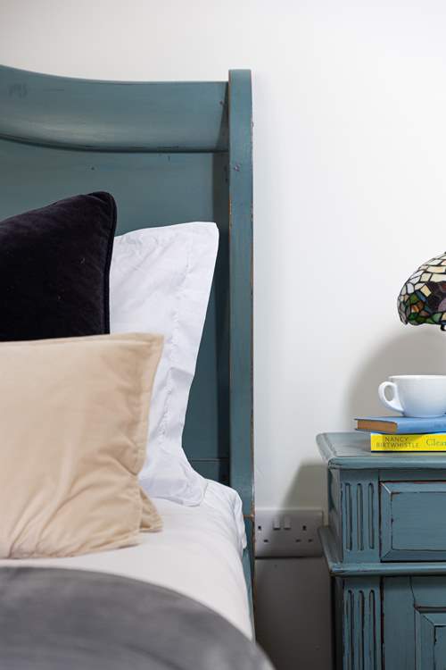 Gorgeous French-inspired furniture adds to the charm of this bedroom.