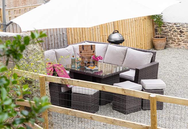 Head outdoors to the gravelled outside space and enjoy the electric barbecue and setting.