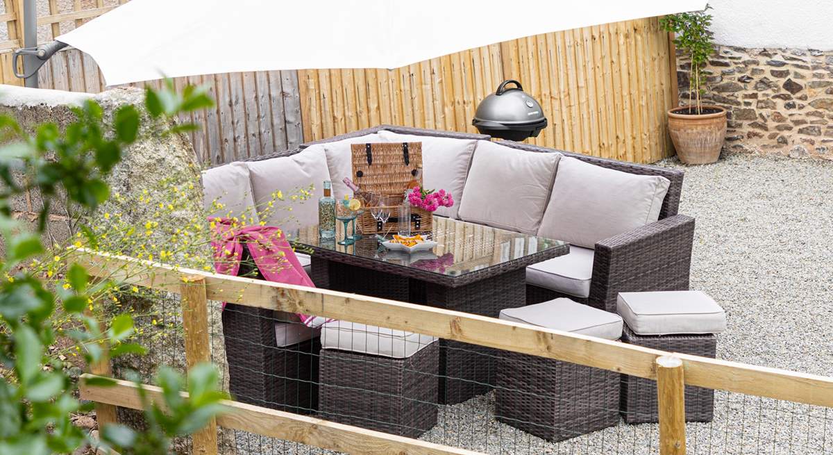 Head outdoors to the gravelled outside space and enjoy the electric barbecue and setting.