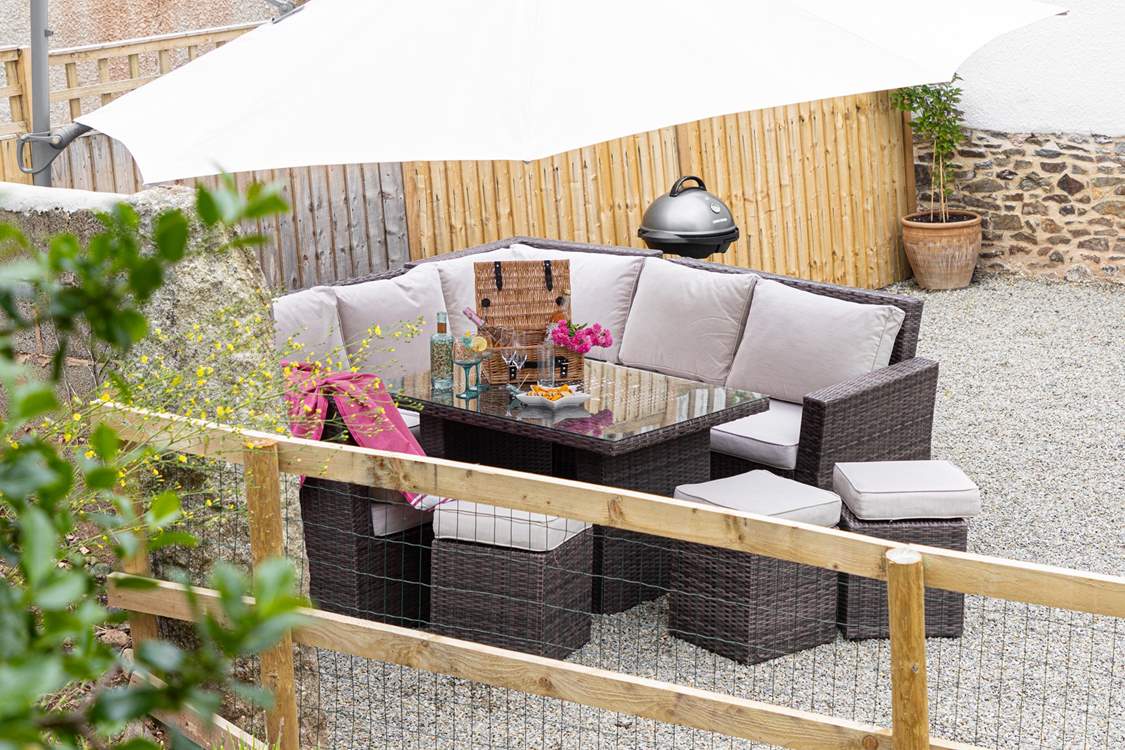 Head outdoors to the gravelled outside space and enjoy the electric barbecue and setting.