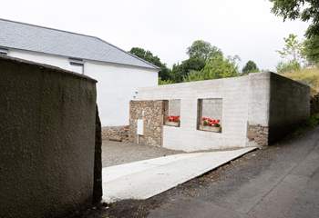 Pull off the lane into the parking courtyard.  Please note the building works have ceased with just the shell being visible. 