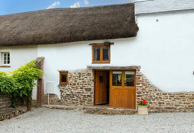 The Hayloft, a rather charming thatched barn in the middle of a lovely Devon village.