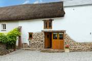 The Hayloft, a rather charming thatched barn in the middle of a lovely Devon village.