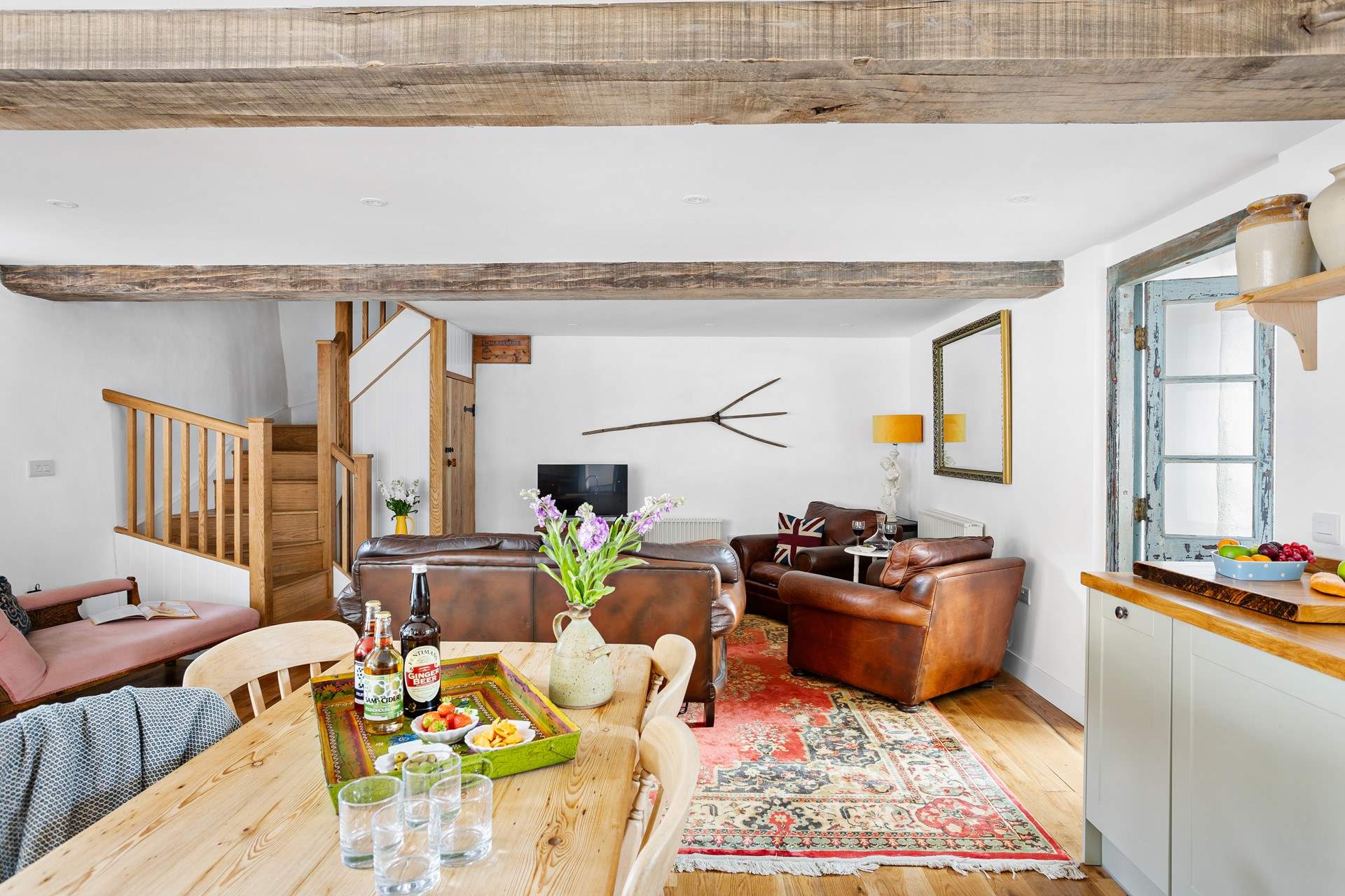 It's filled with gorgeous pieces of furniture adding to the character of this cheerful barn.