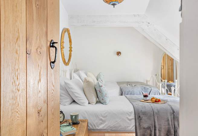 A twin that has views out to the front, please note the sloping ceiling which only adds to the character!