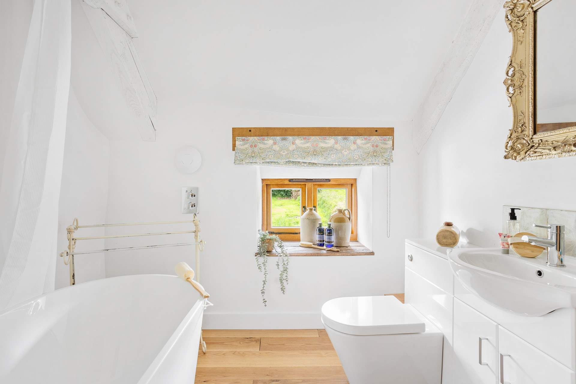 The bathroom has a rainfall shower.