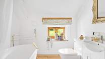 The bathroom has a rainfall shower.