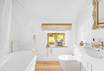 The bathroom has a rainfall shower.
