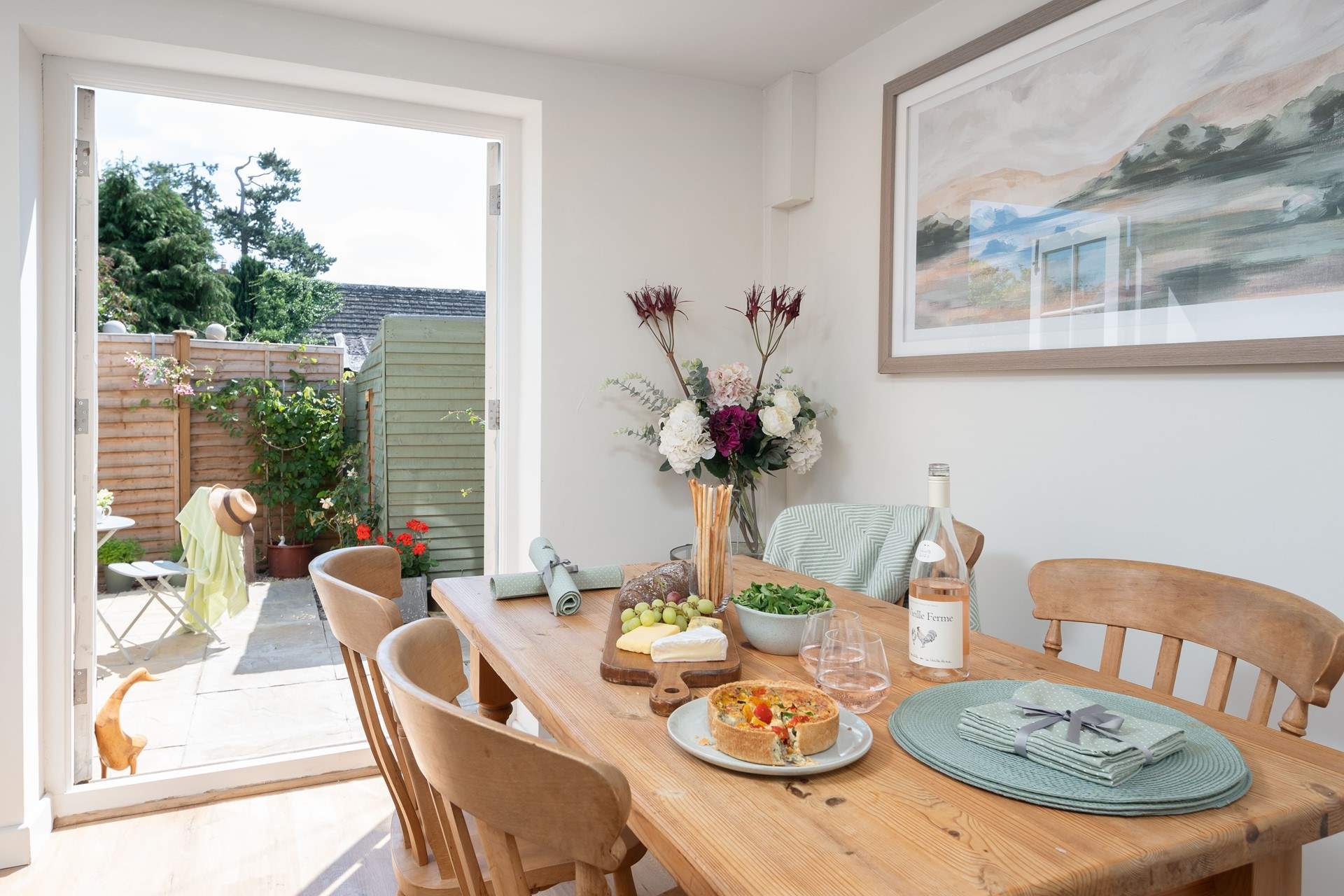 The dining-area enjoys French doors leading out to the garden.