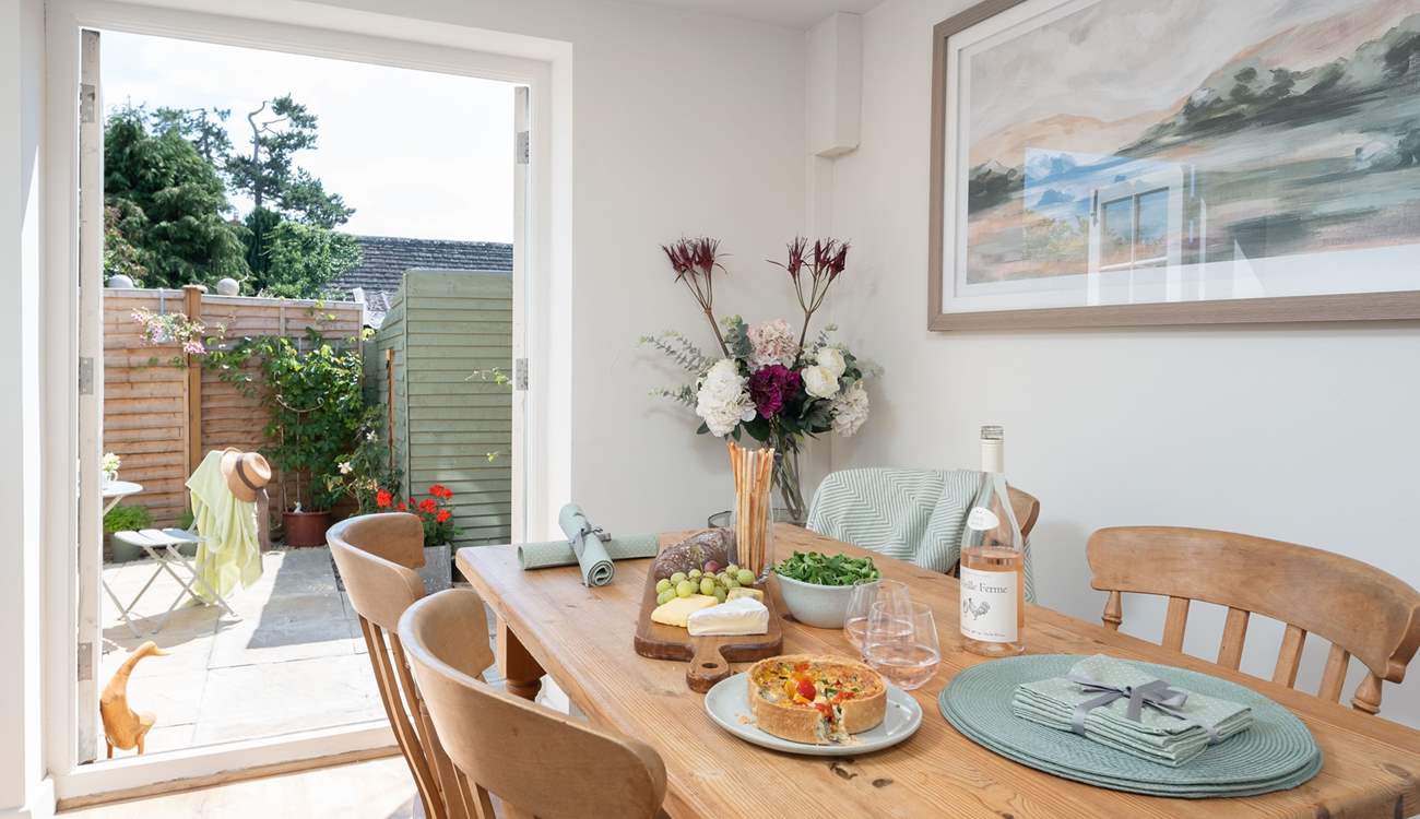 The dining-area enjoys French doors leading out to the garden.