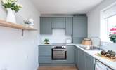 The kitchen is light and airy. - Thumbnail Image