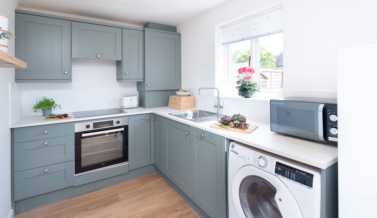 The modernised kitchen is fully equipped.