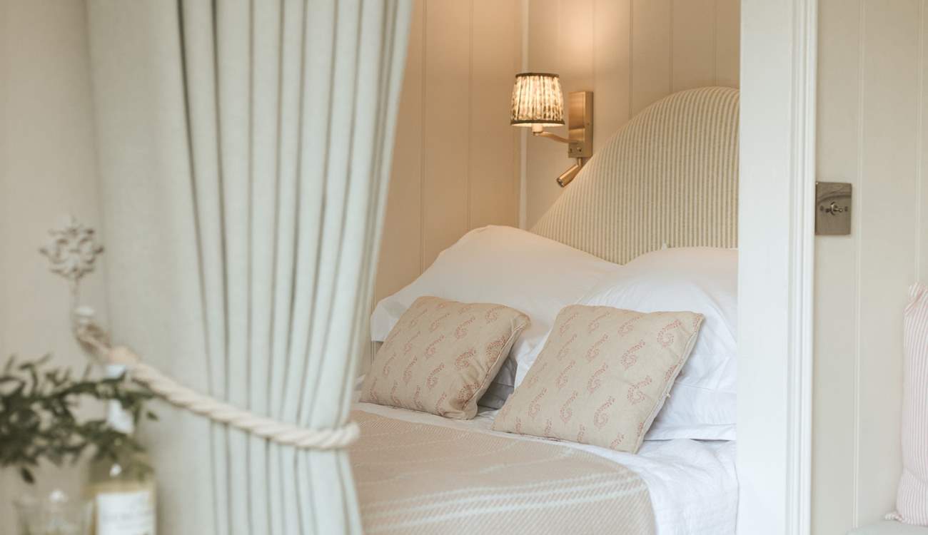 The sumptuous king-sized bed promises sweet slumbers. 