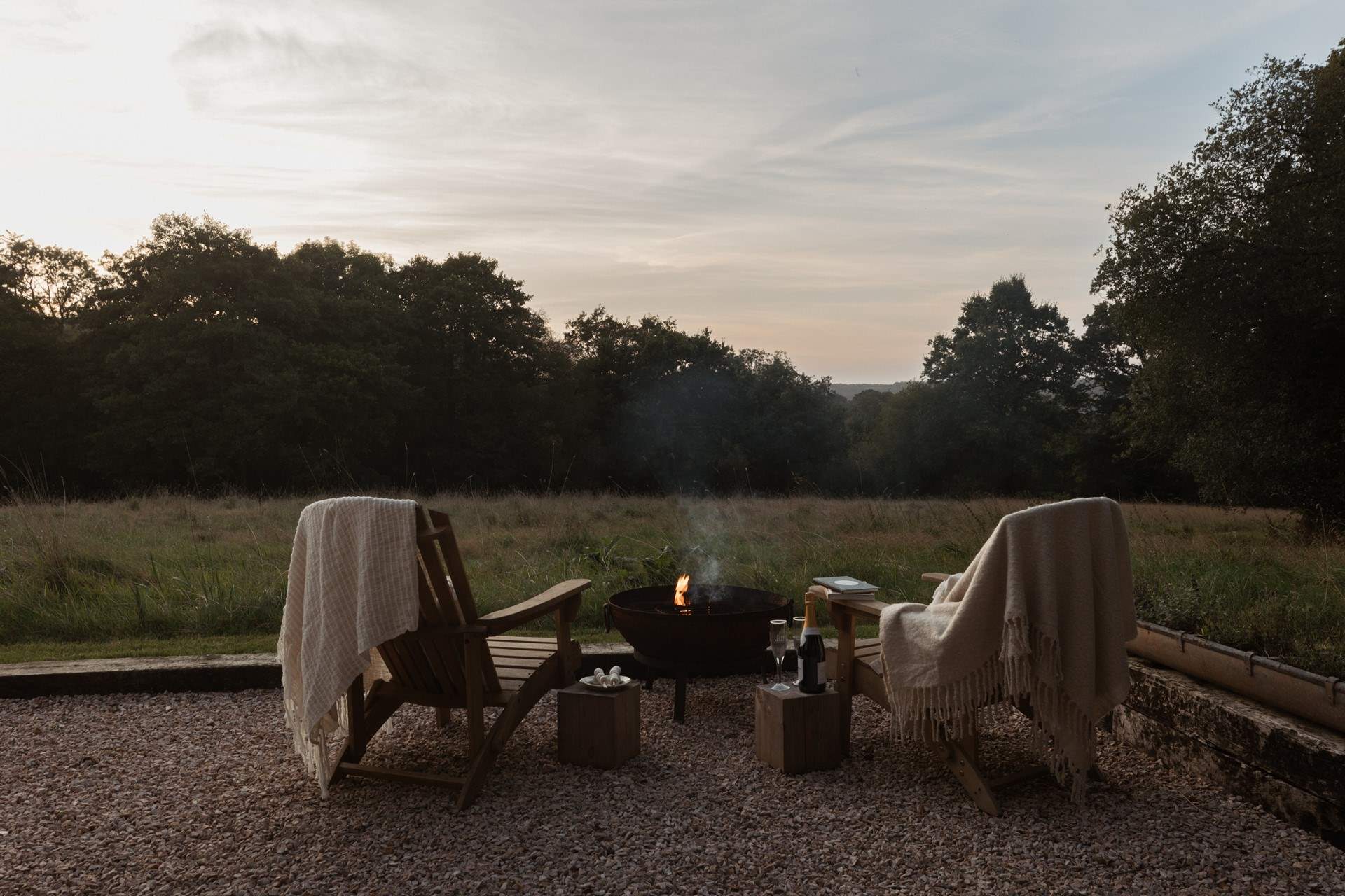 As the evening sun drops, get cosy around the fire pit. 