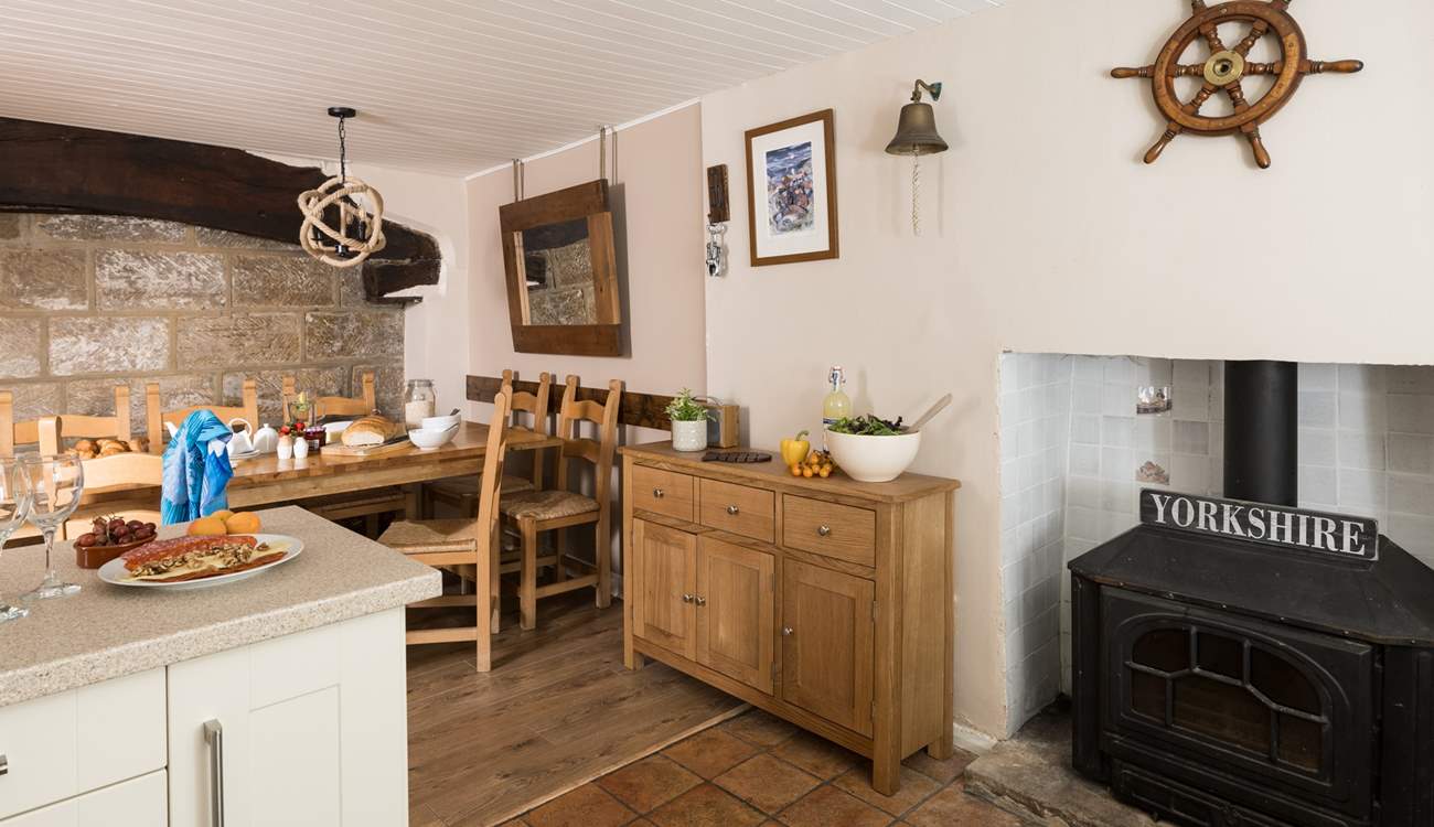 Admire the original beams and the stone wall of the cottage.