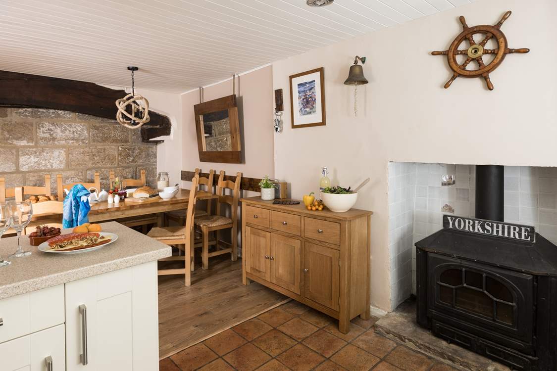 Admire the original beams and the stone wall of the cottage.