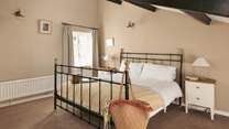 This spacious bedroom has more original features.