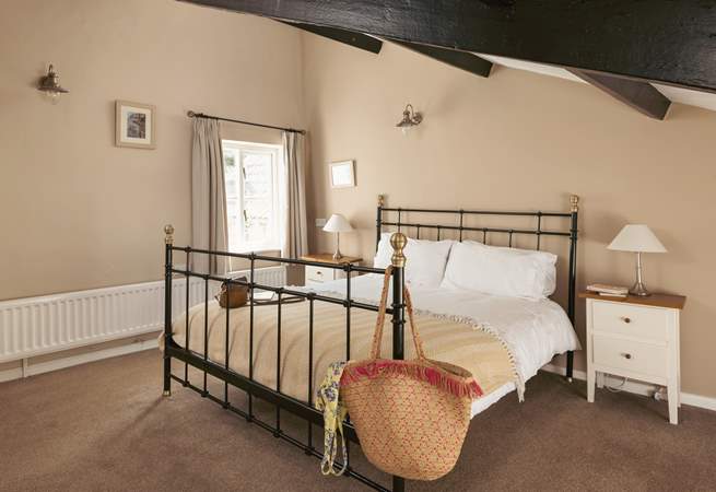 This spacious bedroom has more original features.