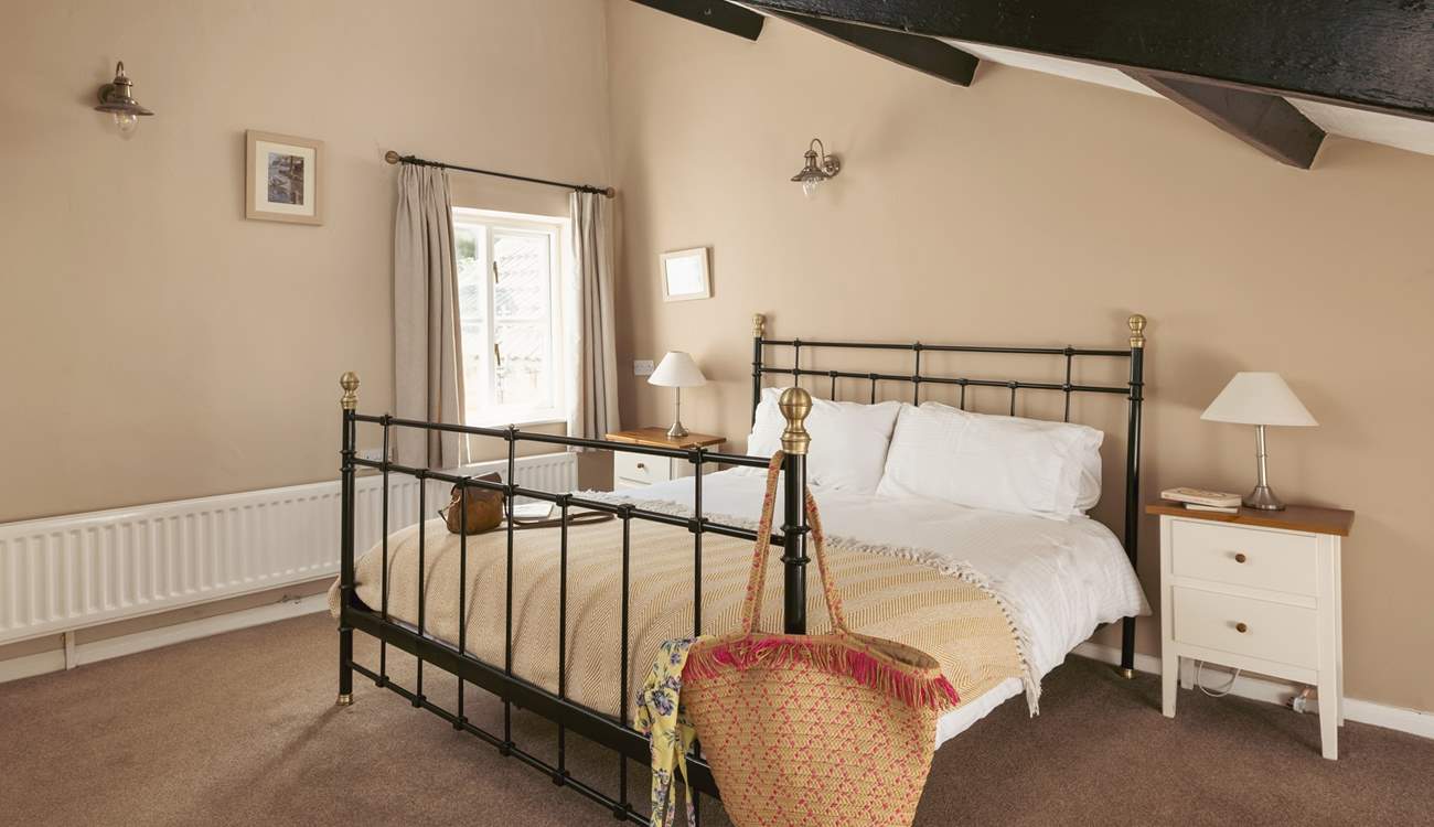 This spacious bedroom has more original features.