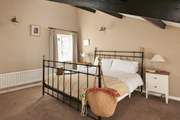 This spacious bedroom has more original features.
