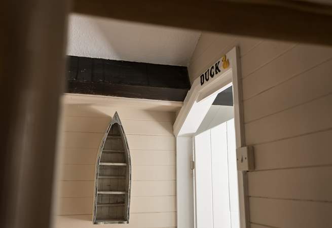 The door to the bathroom has a lovely little reminder to mind your head.