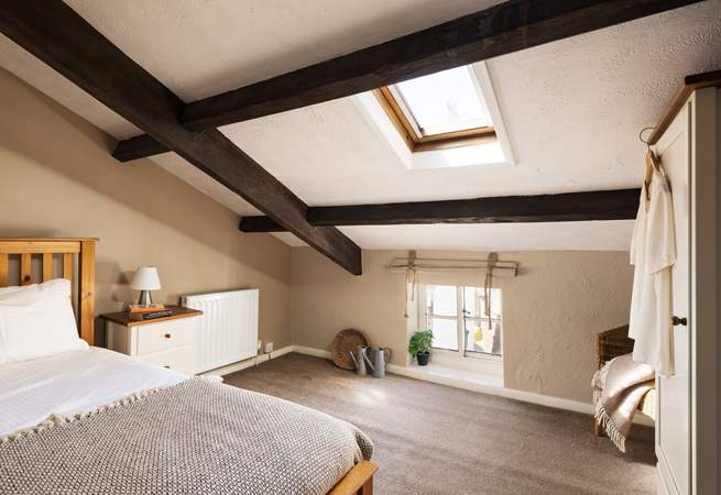 This large single bedroom has views over the cobbled street below.