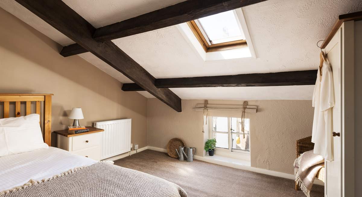 This large single bedroom has views over the cobbled street below.