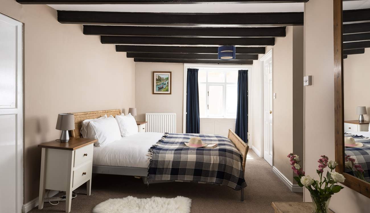 A spacious bedroom with plenty of storage.