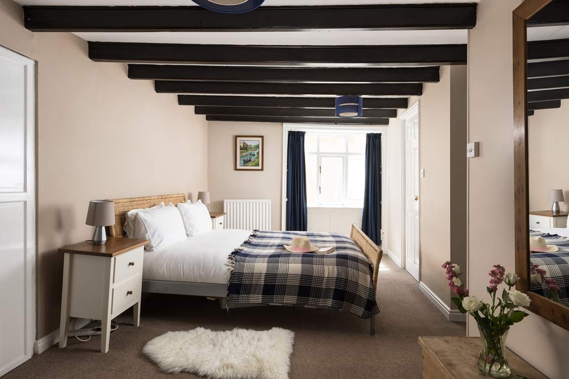 A spacious bedroom with plenty of storage.