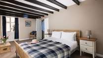 One of the bedrooms showing the original beams.