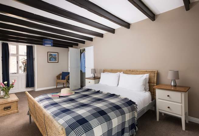 One of the bedrooms showing the original beams.