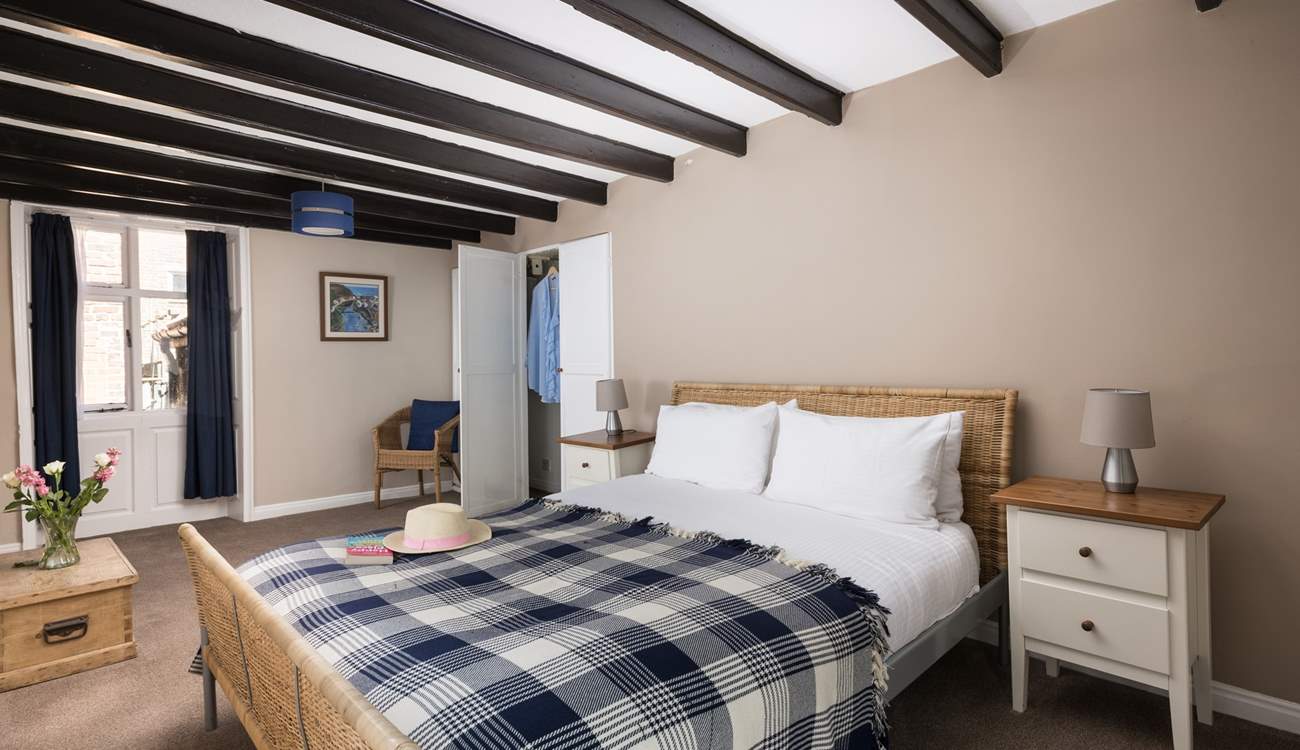 One of the bedrooms showing the original beams.